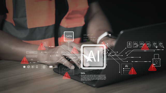 Engineer in safety vest using laptop with AI hologram, digital data network, red warning signs, and cybersecurity padlock. Concept of smart industry technology, data breach, and system error alert.