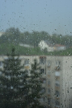 Raindrops sliding down the window pane during a heavy summer storm in Targu Mures.