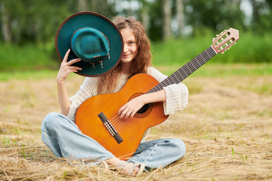 Teen girl with guitar