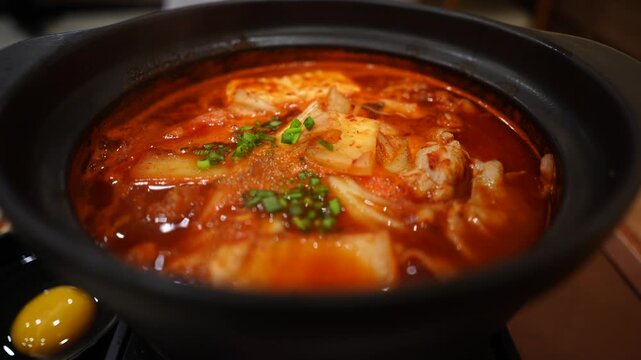 Hot traditional korean dish: Kimchi jjigae at japanese restaurant