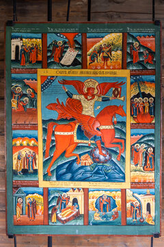 View of the religious icon of Archangel Michael on horseback with surrounding biblical scenes in the Kizhi museum, Petrozavodsk, Republic of Karelia, Russia.