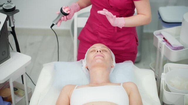 Woman enjoy facial treatment at modern cosmetic clinic, investing in personal wellness, healthy skin and preventive skincare through regular cosmetic care performed by an experienced beautician