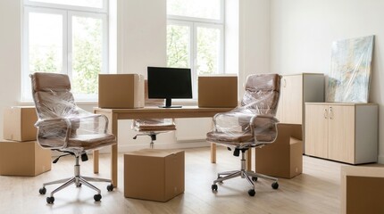 Fototapeta premium Stretch film wrapped chairs and cardboard boxes in a modern office interior during moving day