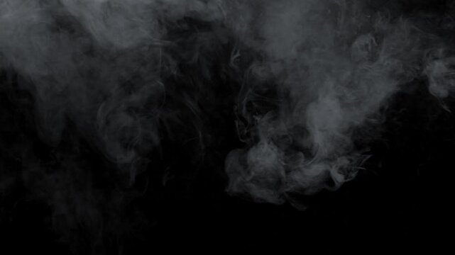 White smoke on a black background. Slow motion. Vape smoke. Vapor , fog, ice smoke cloud , realistic smoke cloud best for using in 4k composition.