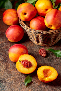Fresh nectarines on a brown vintage background.