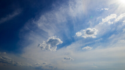Fototapeta premium sunlight and white clouds in a spacious blue sky
