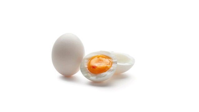 Whole and halved hard boiled egg with breakfast ingredient nutrition culinary centered background prepared wholesome minimalist as transparent cutout