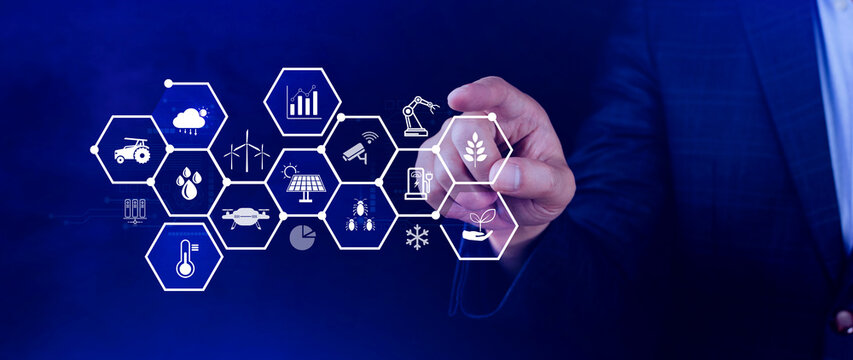 Smart agriculture and agritech concept. Hand using touching digital icons interface of modern farming technology, Agribusiness innovation and smart farming management. not ai