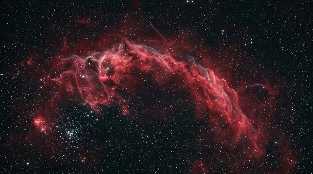 Bright red nebula in deep space with glowing stars