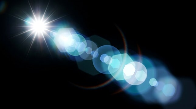 Bright blue lens flare effect on a dark black background