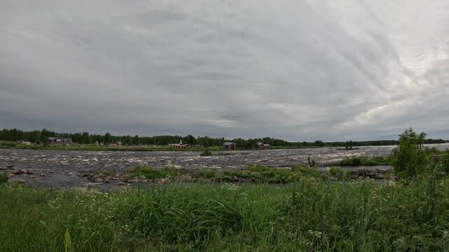 Panoramic wide shot of Kukkolankoski rapids on Torne River between Finland and Sweden