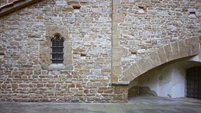 Weathered stone brick wall texture with sharp detail and visible mortar, rustic architectural surface building; background backplate backdrop copyspace.