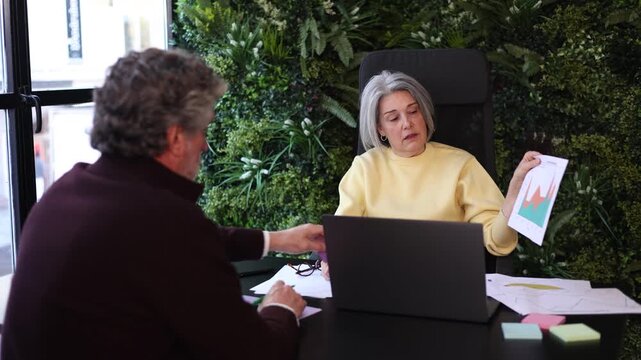 Frustrated senior businesswoman presenting bad financial results