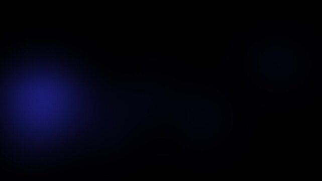 A soft and subtle blue light glow emerges from the darkness in this smooth abstract motion clip.