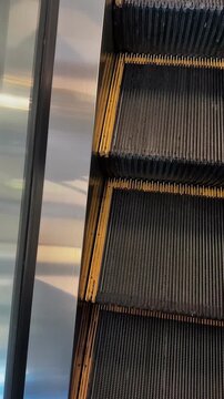 Modern Escalator Close-Up with Metal Steps in Shopping Mall or Office Building
