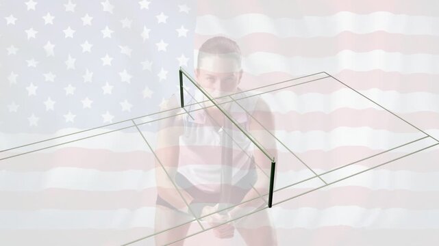 Woman holding paddle and preparing ping-pong serve as superimposed wireframe rotating over flag