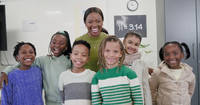 Teacher with children posing in classroom by pi poster placing hands on shoulders smiling