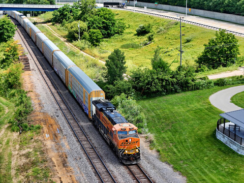 Savanna, Illinois June 22, 2026 BNSF 7917 GE locomotive hauling auto‑rack freight cars on mainline track heading into Savanna, Illinois