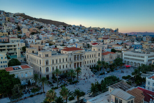 Neoclassical Town Hall and Palm‑Lined Square in Ermoupoli Syros at Dusk