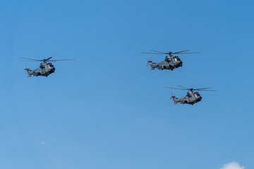 Black modern military transport helicopters flying over Budapest, Hungary © ZenitX