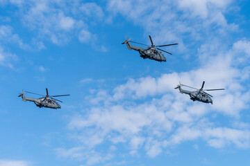 Black modern military transport helicopters flying over Budapest, Hungary © ZenitX