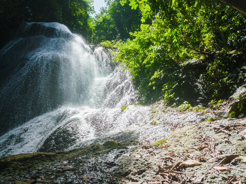Majestic view of Embon Waterfall and river stream scenery at Pasie Raya, Aceh Jaya, Indonesia