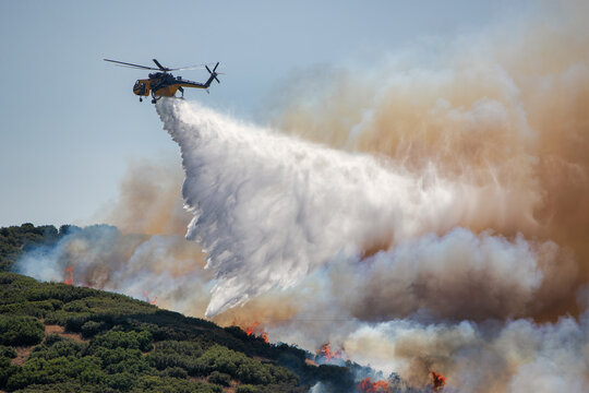 Firefighting Helicopter Battling Derveni Wildfire Under Severe Drought Conditions