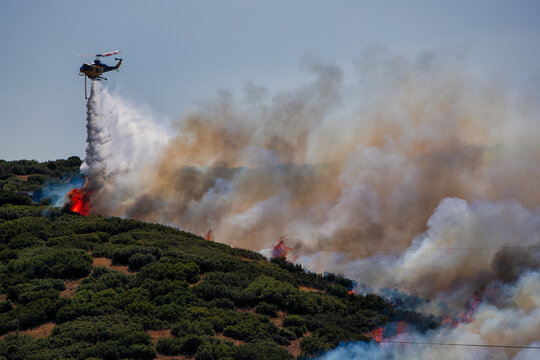 Firefighting Helicopter Battling Derveni Wildfire Under Severe Drought Conditions