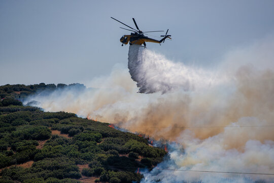Firefighting Helicopter Battling Derveni Wildfire Under Severe Drought Conditions