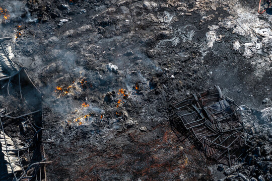 Charred Ground and Collapsed Metal Structures After the Oraiokastro Wildfire