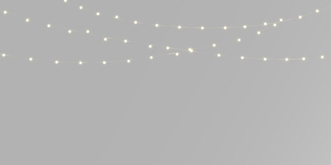 Obraz premium Glowing garland with warm yellow lights, tiny golden bulbs and elegant hanging Christmas strings