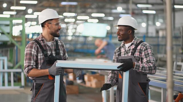 Diverse factory workers manufacturing pvc window frames