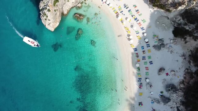 Aerial drone view of turquoise bay with boats near Agios Nikitas, Lefkada, Greece