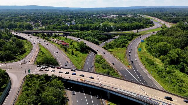 Heavy rush hour traffic moves along a busy highway during peak commuting time. Suitable for transportation, city infrastructure, road congestion, mobility, and modern urban travel concepts.