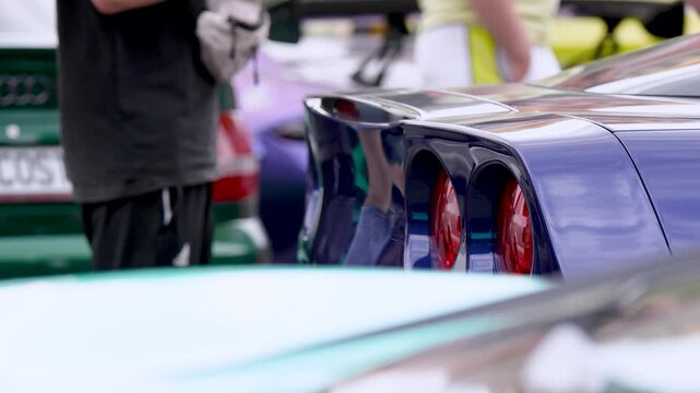 Two round rear taillights of a classic American vintage muscle car, close up detail
