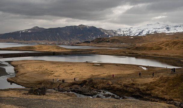 Snafellsnes peninsula landscape tranquil lakes, Grundarfjordur village, and snow capped mountains. Kirkjufell hiking trail Iceland. Icelandic landscape