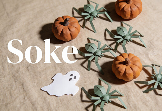 Halloween decor, mini pumpkin, paper spider, ghost cutout, autumn craft, spooky flatlay, october seasonal arrangement, table top decoration, handmade craft design, holiday concept, festive party theme