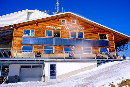 Mannlichen, Grindelwald, Switzerland - 13.03.2026. A sunny, low-angle shot of the wooden Luftseilbahn Wengen-M&auml;nnlichen cable car station building in Switzerland. The traditional timber facade feature