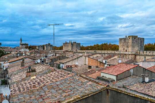 The houses of the historic city center of Aigues-Mortes in France, Occitanie, Gard seen from above the medieval walls