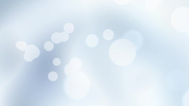 Pure white, subtle sky blue, and silver fluid gradient wave loop filled with soft glowing bokeh light spheres for modern tech video background overlay