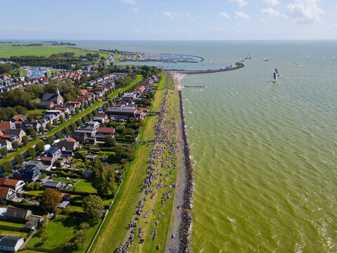 STAVOREN, THE NETHERLANDS AUGUST 12, 2023: Traditional Skutsjes Compete During the Annual SKS Skutsjesilen Sailing Championship on the IJsselmeer