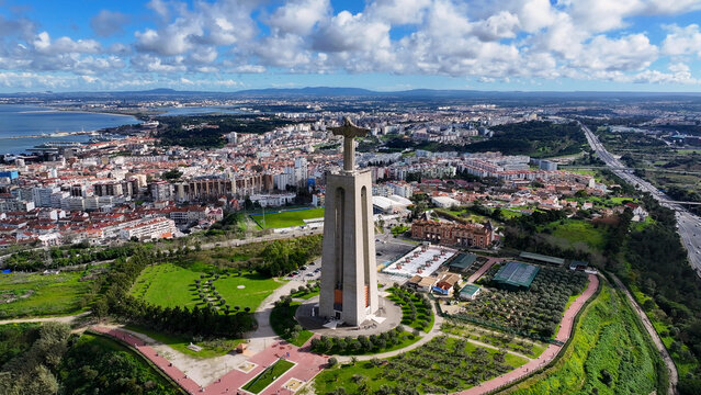 King Christ In Almada District Of Lisbon Portugal. Unesco World Heritage Of Christ The Redeemer Statue. Industry Skyline Commercial Building Awesome. Commercial Building Architecture Business.