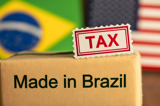 Package labeled "Made in Brazil" with a tax stamp and blurred Brazilian and U.S. flags, representing tariffs on Brazilian exports to the United States.