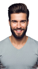 Obraz premium Young caucasian man (early 20s) with dark coiffed hair and stylish beard, smiling widely in a gray v-neck shirt, high-key studio portrait with bokeh. Concept of youthful confidence and approachability