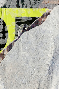 Old billboard background with pieces of torn peeling paper placard