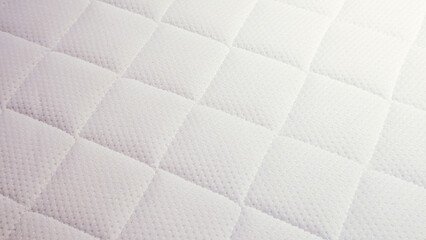 Obraz premium white quilted mattress fabric texture close-up background