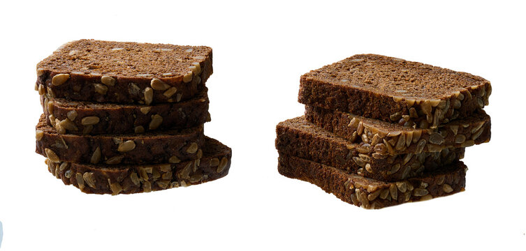 stacked pieces fresh wholemeal rye bread with sunflower seeds, isolated on white background.