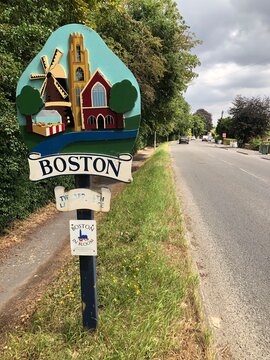 Signpost on the roadside featuring a painting of the famous stump in Boston Lincolnshire UK. July 2026