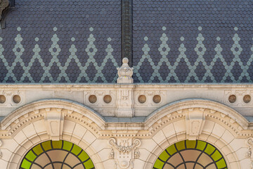 Arched roundel windows and cornice detail on the Royal Riding School building at Buda Castle in Budapest, Hungary © GuillaumeAngleraud