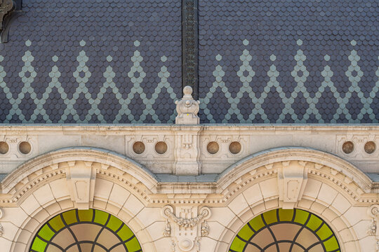 Arched roundel windows and cornice detail on the Royal Riding School building at Buda Castle in Budapest, Hungary